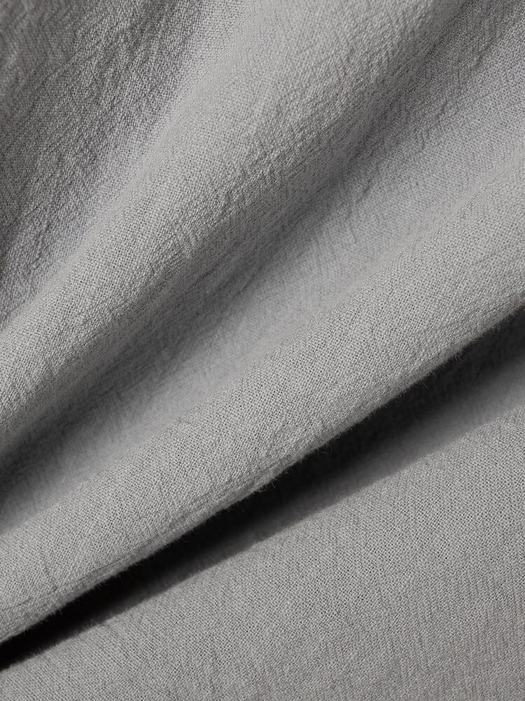 Camisa casual de algodón y lino con cierre de medio botón