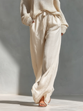 Pantalón ancho beige de lino con bolsillos