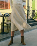 La falda de tweed de cintura alta con botones de perla
