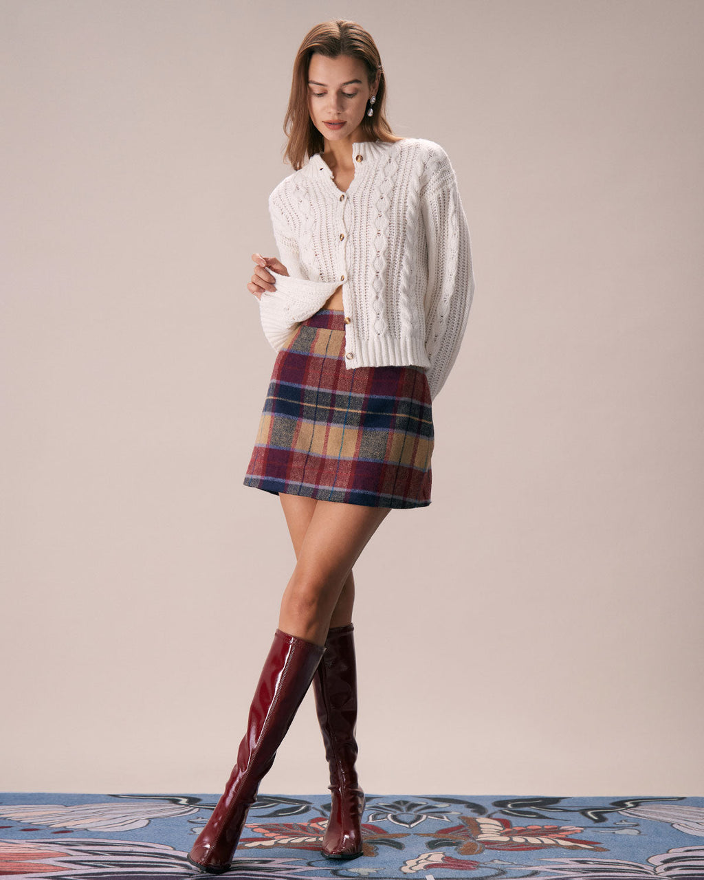 Falda corta de tweed a cuadros rojos con cremallera