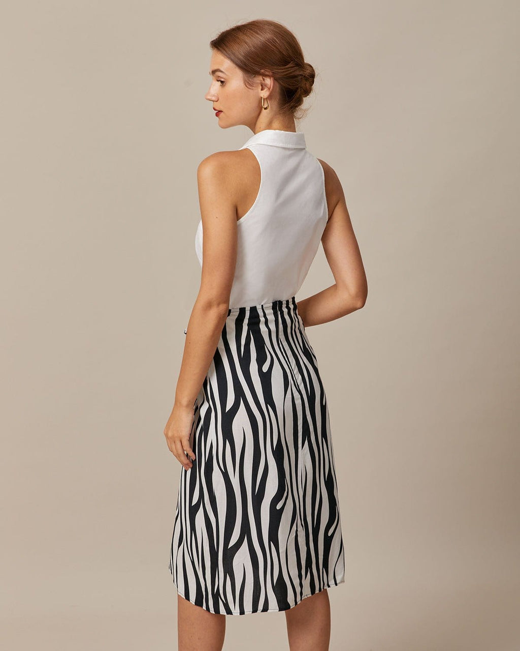 Camisa blanca sin mangas con cuello y botones