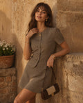 Blusa de cuadros marrones con mangas abullonadas