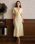 Vestido maxi de túnica amarillo con escote en V y lazo