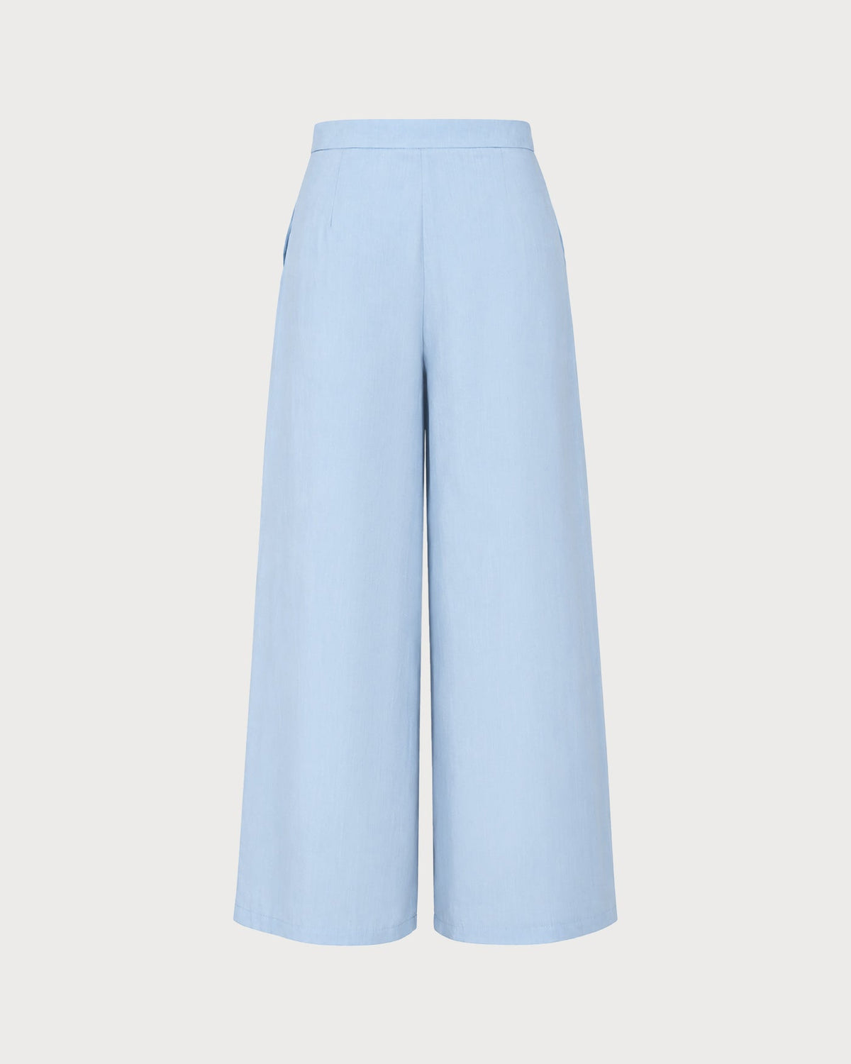 Pantalones rectos de color azul sólido con bolsillos