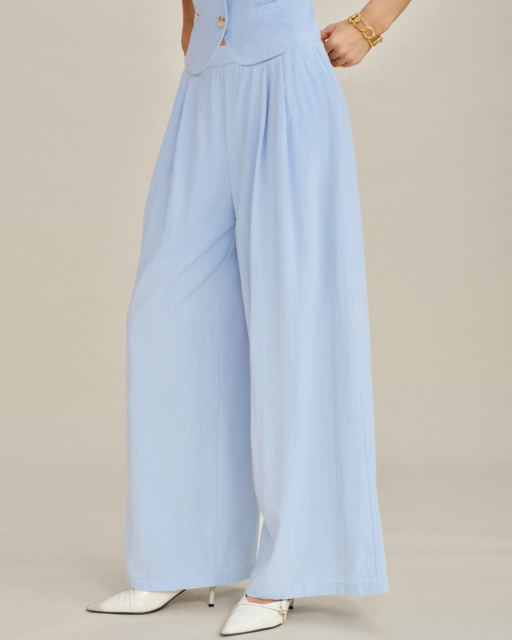 Pantalones rectos de color azul sólido con bolsillos